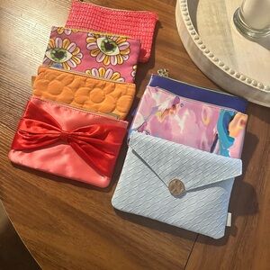 This is a Lot of six makeup bags and Makeup and Facial items